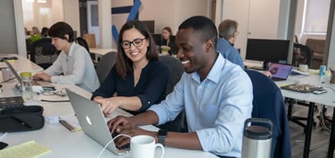 Researchers collaborating at a shared desk