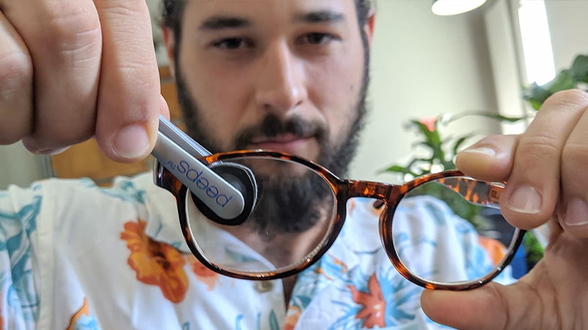 Peeps carbon lens cleaner clipping onto glasses